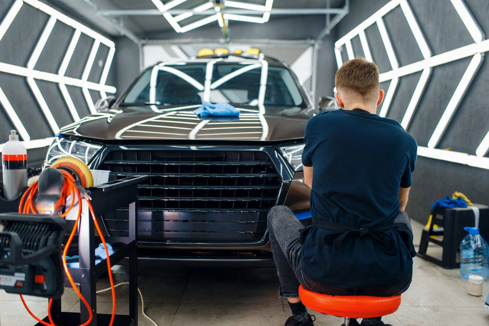 male-worker-polishes-car-surface-detailing.jpg